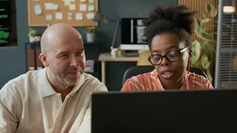 Young Black Female Programmer Teaching Middle-Aged Male Employee 스톡 동영상 306843684