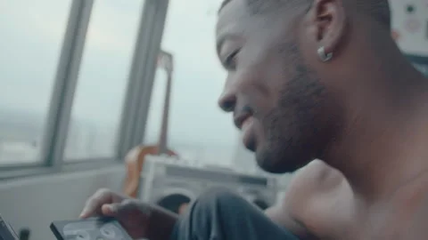 Young Black Guy Chatting about Cassette Tapes with Girlfriend Stock Footage 236682378