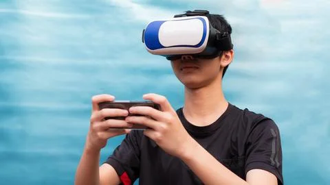 A young black haired Asian man playing VR Technology. The boy raised his ha.. Stock Illustration