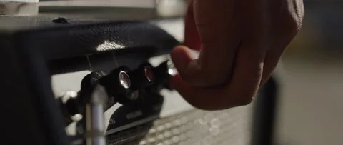 Young Black Hand Adjusts Knobs on Amplifier, Close Up, Slow Motion 動画素材 132689759