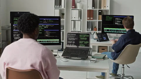 Young Black Male App Developer Typing Code on Computers at Workstation Vídeos de archivo 330131242