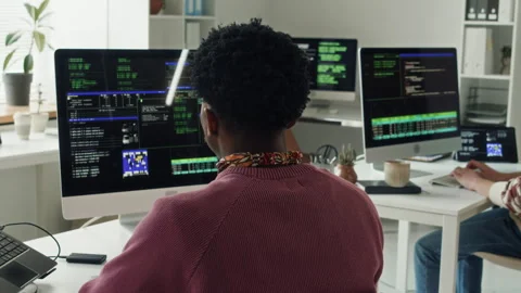 Young Black Male IT Engineer Coding on Computer in Office Stock Footage 330128922