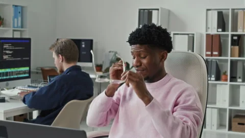 Young Black Male Programmer Stretching Arms while Working on Computer in Office Stock Footage 330129820