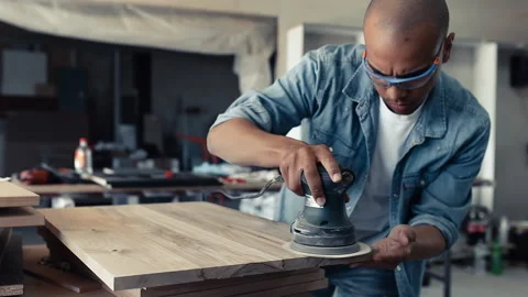 Young black man carpenter working in his workshop. Stock Footage 155357761