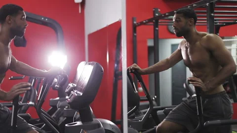 Young black man during exercise on elliptical trainer. Stock Footage 101520499