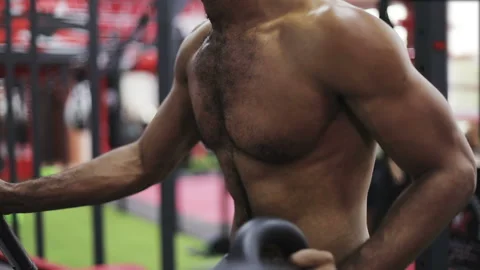 Young black man during exercise on elliptical trainer. Stock Footage 101520903