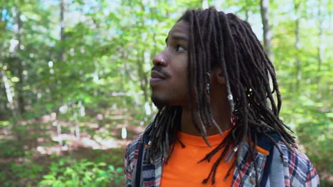 Young Black Man Explores Forest Setting Stock Footage 142014899