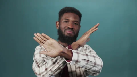 A young black man is gesturing and looking at the camera Stock Footage 170914726