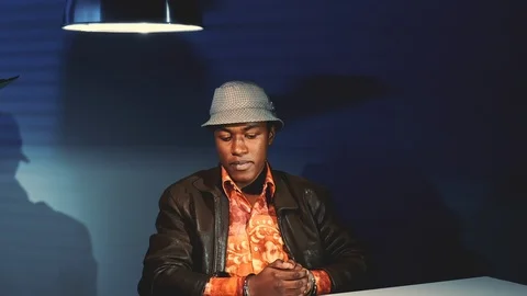 Young black man in handcuffs refusing accusation in his address Stock Footage 122918582