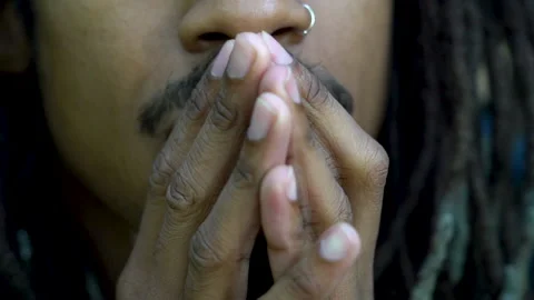 Young Black Man With Hands In Prayer or Contemplation In Front of Face Vidéo 142013054