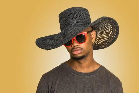 Young black man in hat and sunglasses Stock Photos