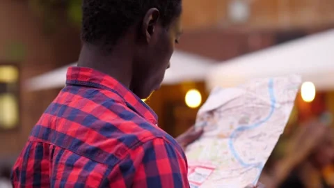 Young Black Man with Map Navigating Trastevere Stock Footage 252844728