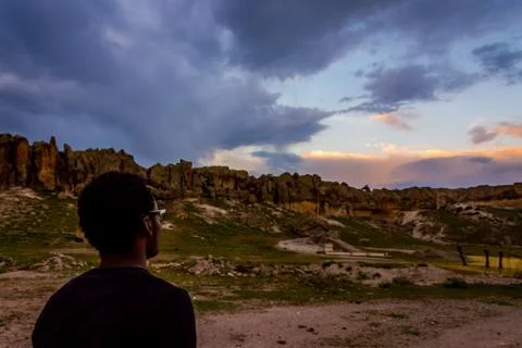 Young black man posing in front of Frig ruins Stock Photos