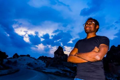 Young black man posing in front of Frig ruins Stock Photos