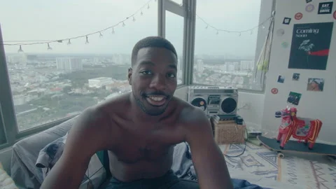 Young Black Man Smiling on Camera in Bedroom Video stock 236687670