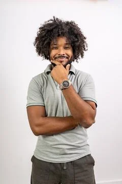 Young black man smiling posing thoughtfully Stock Photos