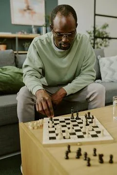 Young Black Man Solving Chess Problem Stock Photos