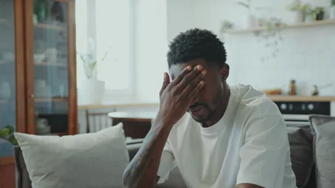 Young Black Man Suffering from Splitting Headache at Home Stock Footage 282187894