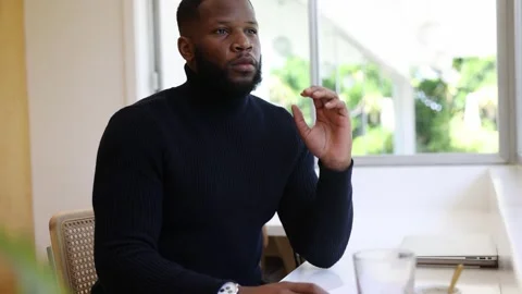 Young Black Man Thinking About Life. Close Up Thoughtful Man Stock Footage 243097616