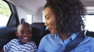 Young Black Mother With Boy In A Car Going On Road Trip Stock Footage