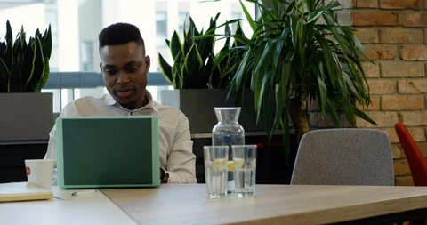 Young Black Office Worker Getting Advice from Middle Aged Colleague - Medium Stock Footage 129041410