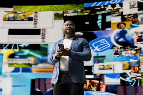 Young black professional explores a tech driven environment with visual data Foto stock