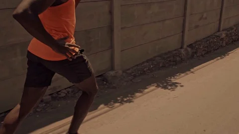 Young black runner man doing urban running workout Stock Footage 128812911