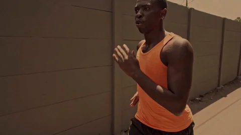 Young black runner man doing urban running workout Stock Footage 128812937