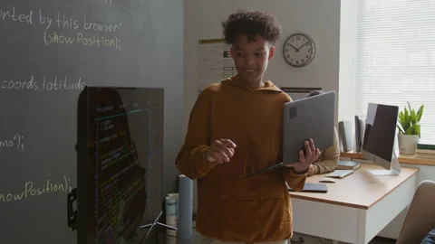 Young Black Student with Laptop Presenting Code on Screen at Lesson Stock Footage 318712160