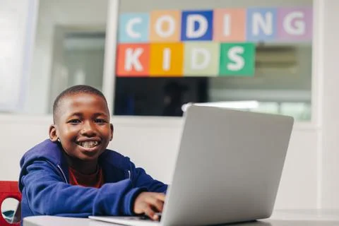 Young black student learning to code in a computer-based learning school Stock Photos
