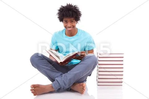 Young black teenage student men reading a books - african people Stock Photos