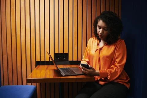 Young Black Woman Checking Smartphone Notifications While Sitting Alone Stock Photos