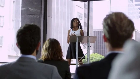 Young black woman presenting seminar to a business audience Stock Footage
