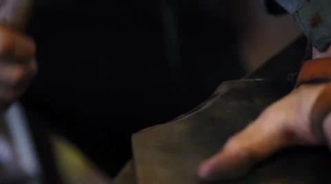 Young blacksmith hammering Stock Footage 44631737