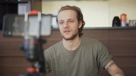 Young blogger explaining how to use sanitizer in livestream Stock Footage 128655001