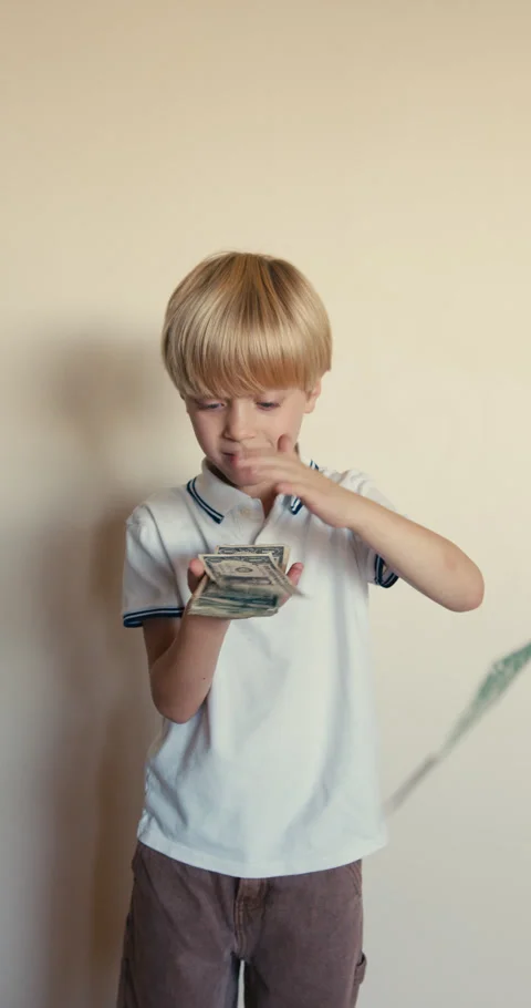 Young blond boy happily counting money 스톡 동영상 346983459