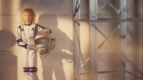 Young blond girl astronaut Stock Footage