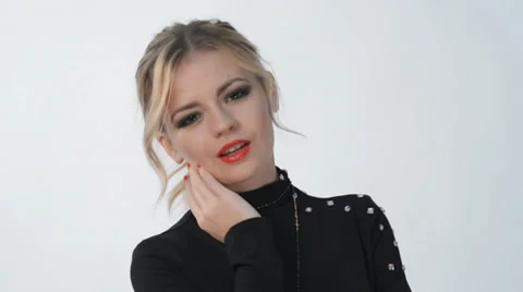 Young blond girl posing in studio Video stock 32716646