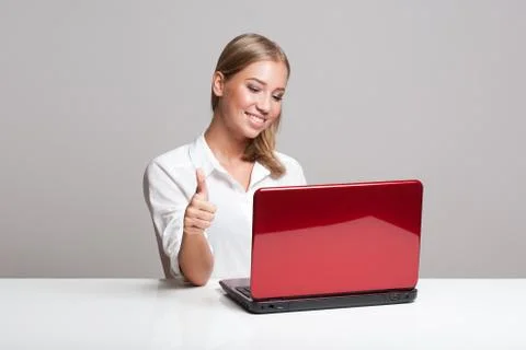 Young blond with her computer. Stock Photos