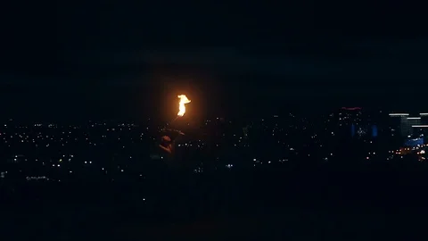 Young blond male does tricks with fire, Male breaths out large stream of fire Vídeo Stock 105214116