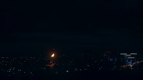 Young blond male does tricks with fire, Male breaths out large stream of fire Stock Footage 105214200