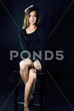 Young blond real woman emotional in depression dark indoor Stock Photos