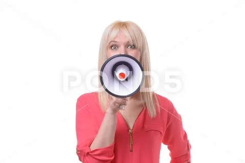 Young blond woman yelling into a megaphone Stock Photos