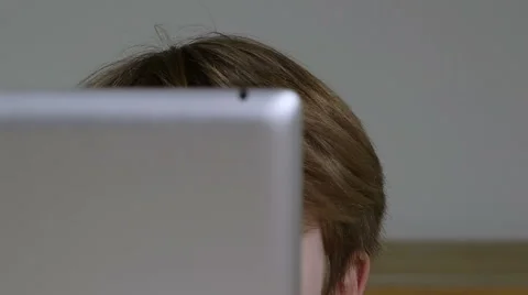 Young blonde boy behind tablet Stock Footage 47989244