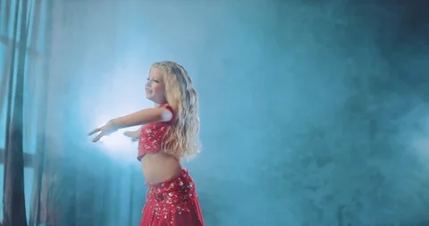 Young blonde dances oriental dance in a beautiful suit with stones. Smooth Stock-Footage 109487725