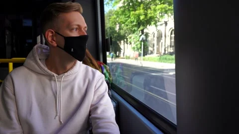 Young blonde guy wearing protective face mask during covid-19 pandemic. Stock Footage 145964178