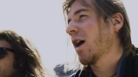 Young Blonde Man Singing Outdoors Stock Footage