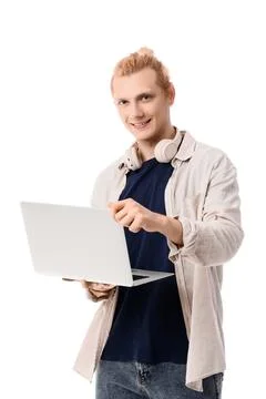 Young blonde man using laptop on white background Stock Photos