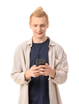 Young blonde man using mobile phone on white background Stock Photos