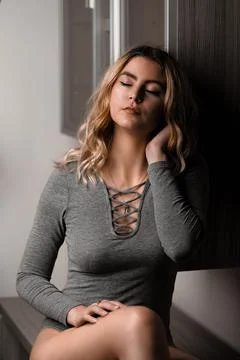 Young blonde model posing in her room Stock Photos